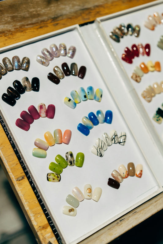 a couple of pictures of different colored nails