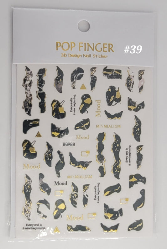 Packaging of POP FINGER 3D Design Nail Sticker #39 with black and gold designs on a white background.