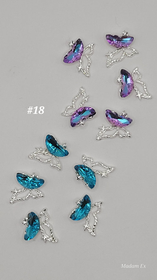 10 Colorful butterfly-shaped charms purple and blue sets on a gray background