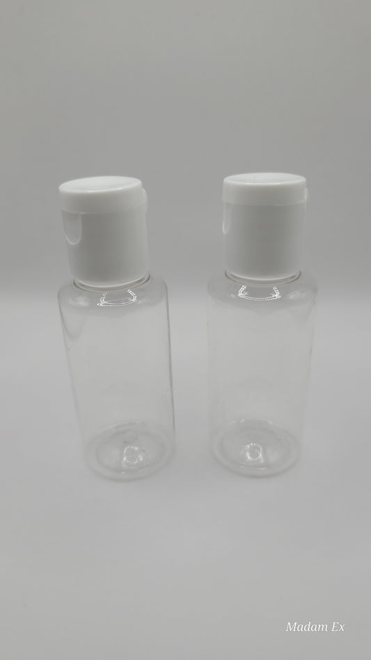 Two clear plastic bottles with white caps on a light gray background