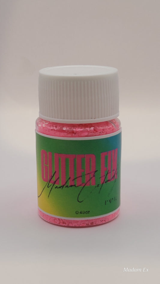 Bottle of Pink Glitter Fix with green label and pink contents on a white background