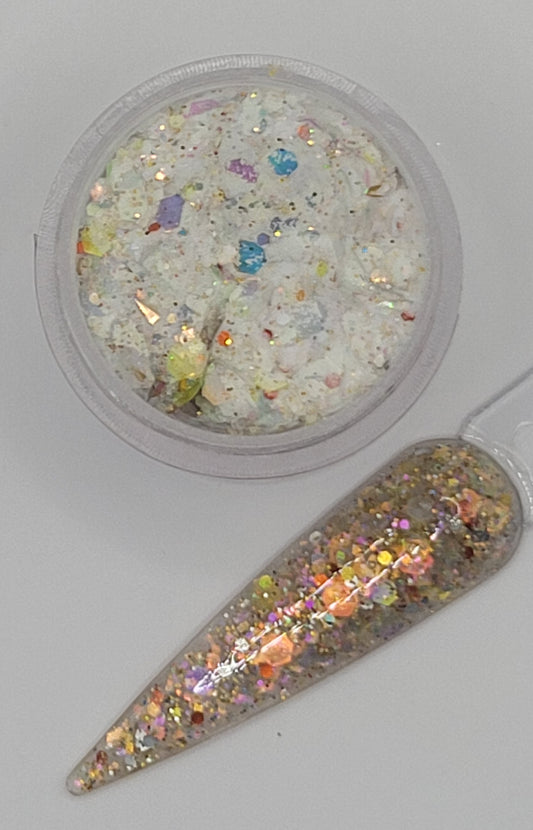 top view glow in the dark Iridescent glitter acrylic in a jar next to a swatchstick against a light gray background