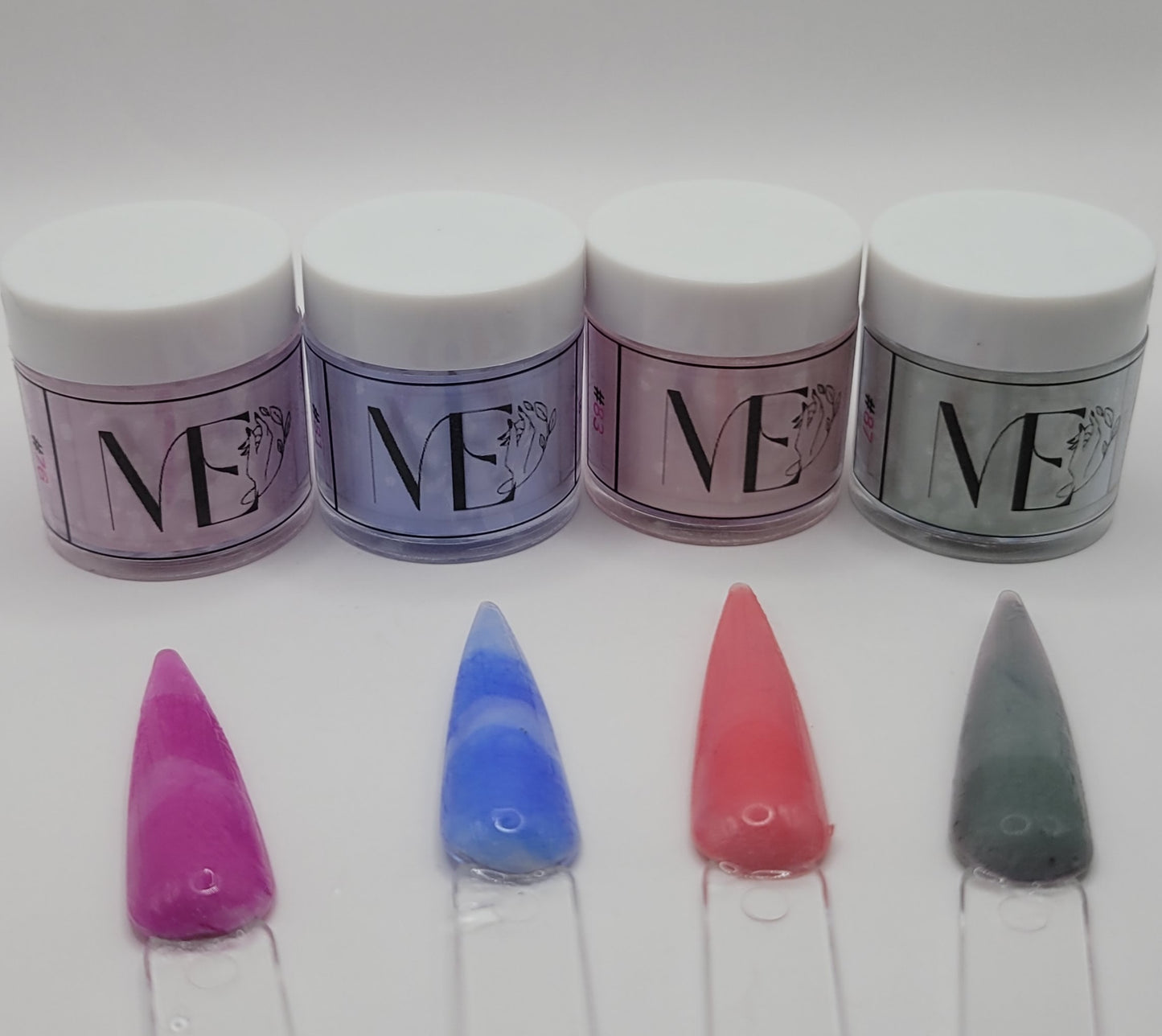 Four jars of powder with 'ME' branding and four colorful nail samples in front on a white background.