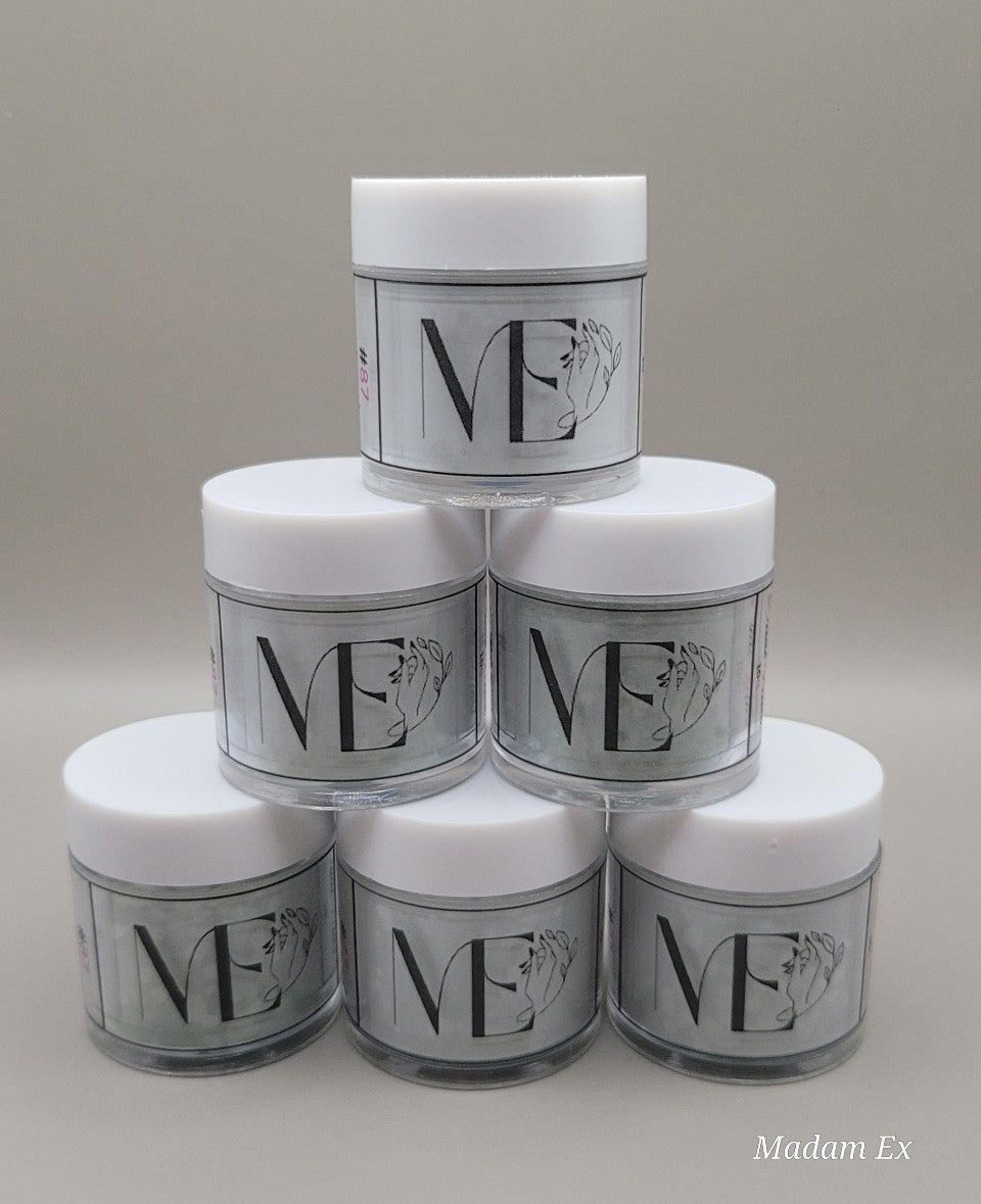 Stack of jars with white tops and green duo acrylic with 'ME' branding on a neutral background