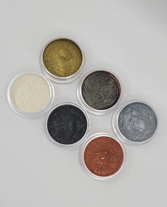 six piece gold, silver, gray, copper, black and pearl metallic mica against a white background
