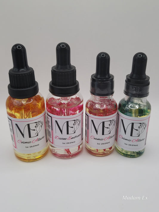 four bottles of ME cuticle oil product with dropper caps on a light gray background.