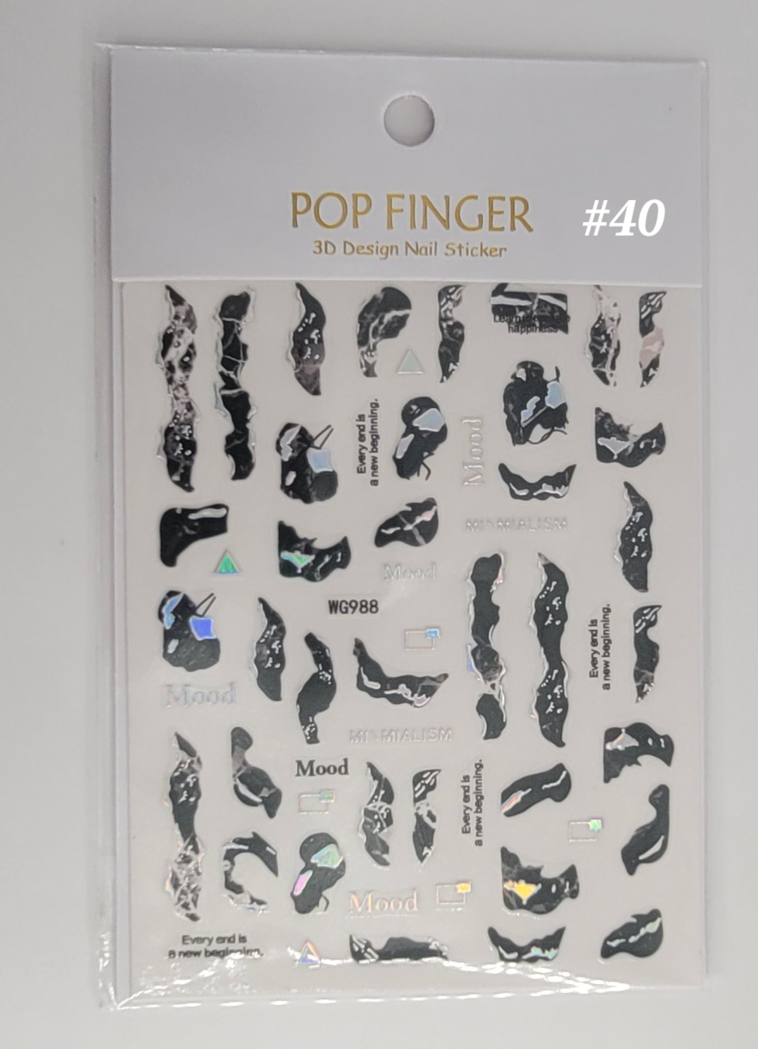 Packaging of Pop Finger 3D Design Nail Sticker #40 with black and white designs on a clear background.