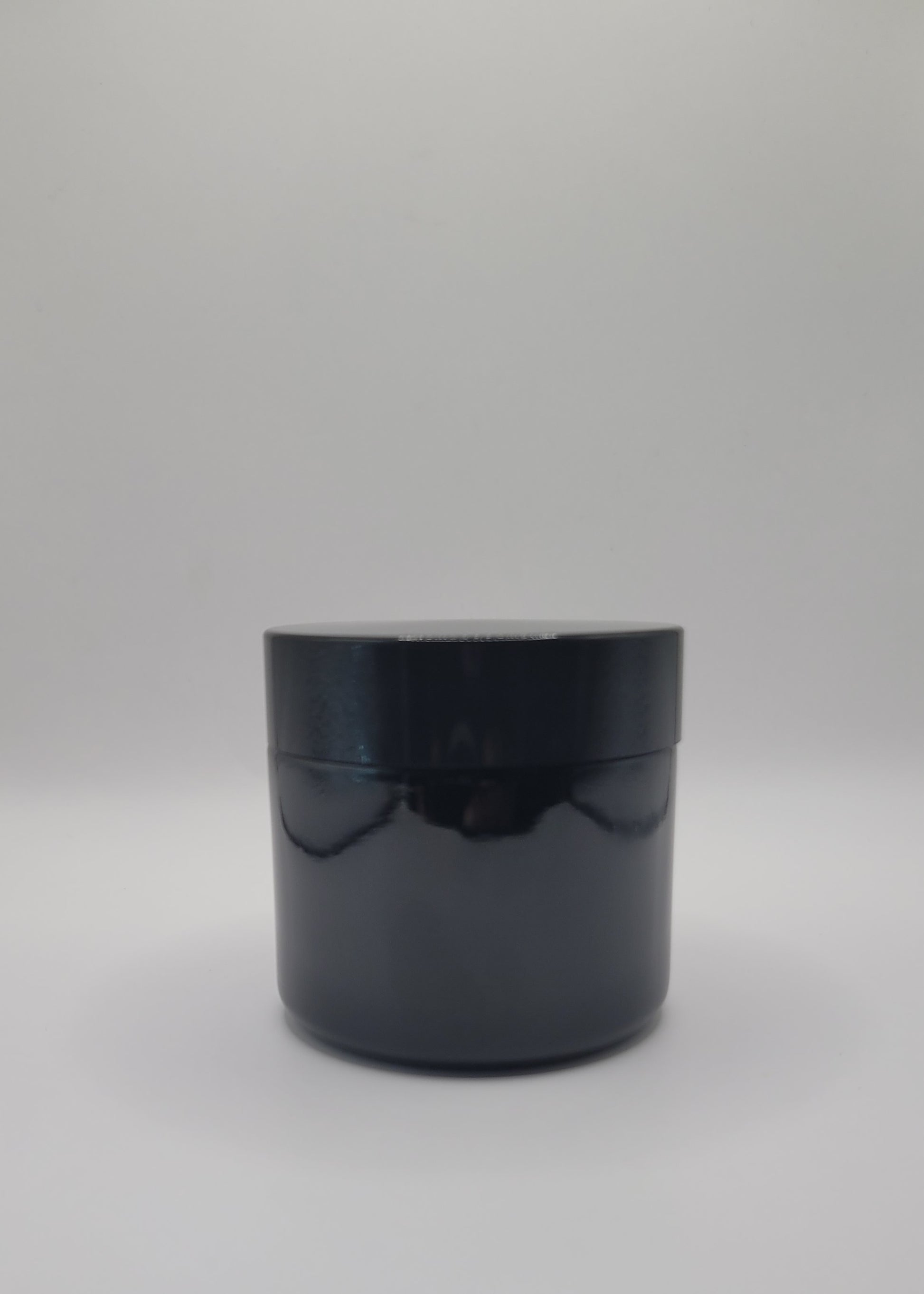 Black cylindrical container on a white background