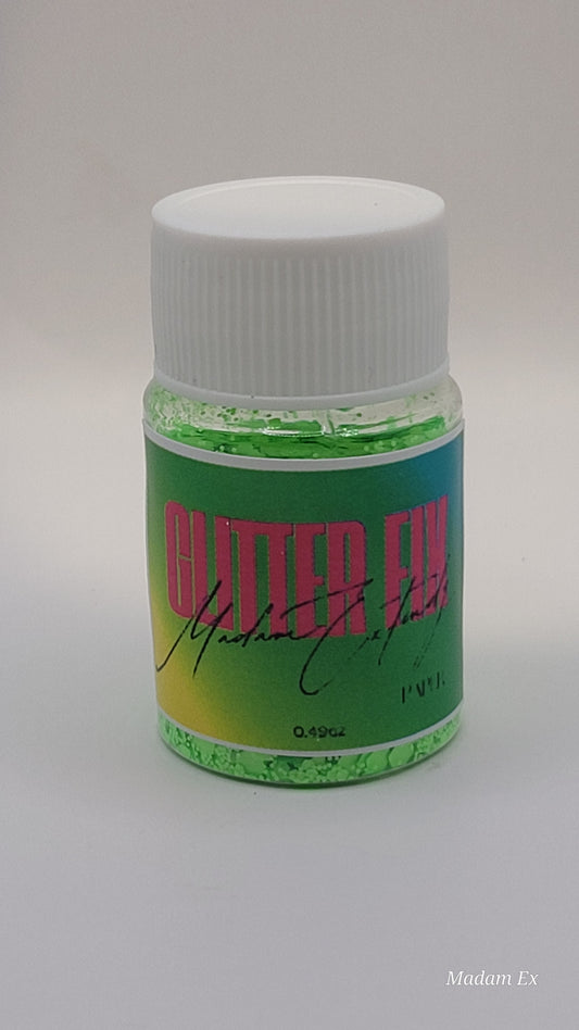 Bottle of green Glitter Fix  with green label and pink contents on a white background