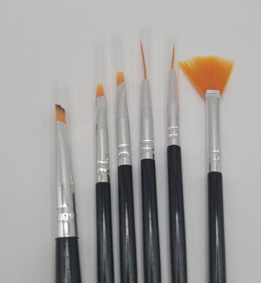 6pcs orange tip black and silver nail art brush set on a white background