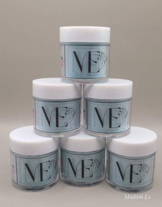 Stack of white top blue acrylic jars with 'ME' branding on a gray background