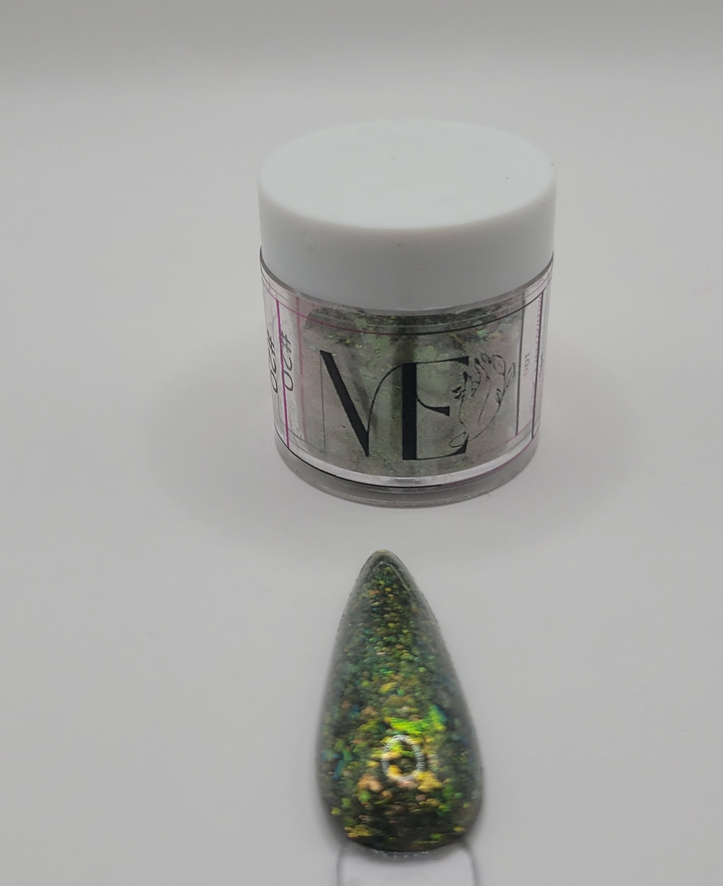 1 Jar of chameleon glitter Acrylic powder with 'ME' branding and a nail art swatchstick samples on a white background