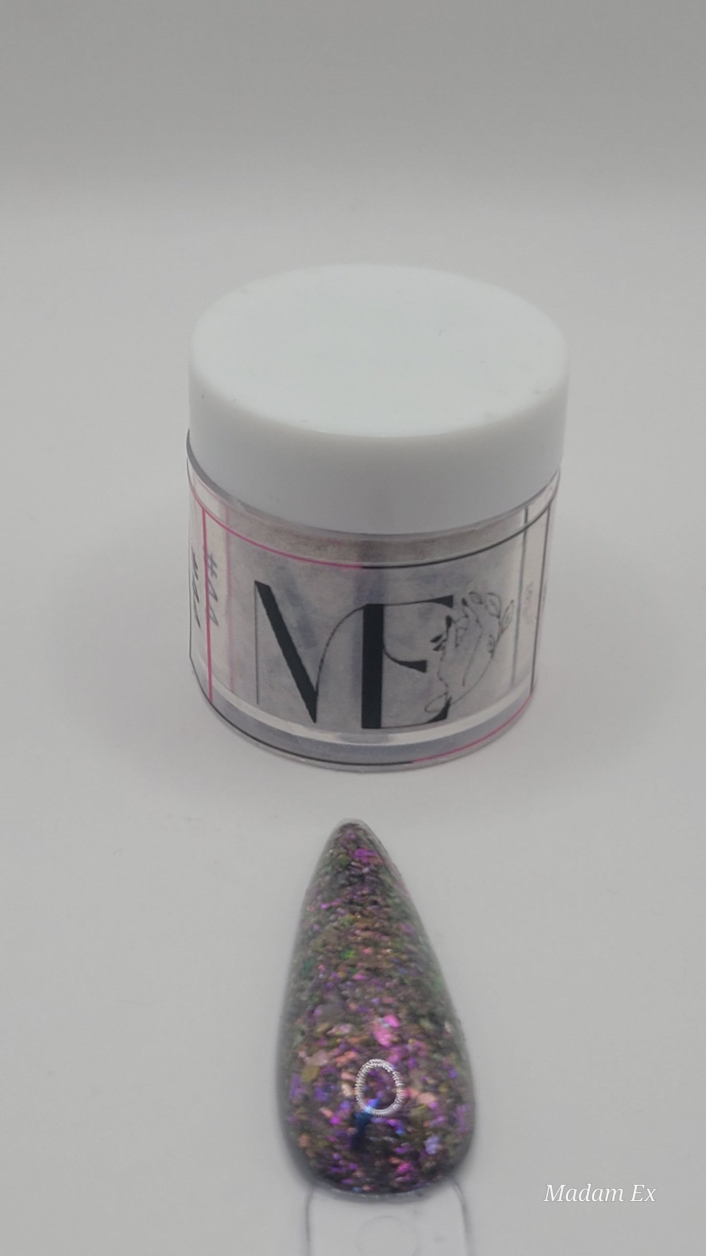 1 Jar of chameleon glitter Acrylic powder with 'ME' branding and a nail art swatchstick samples on a white background