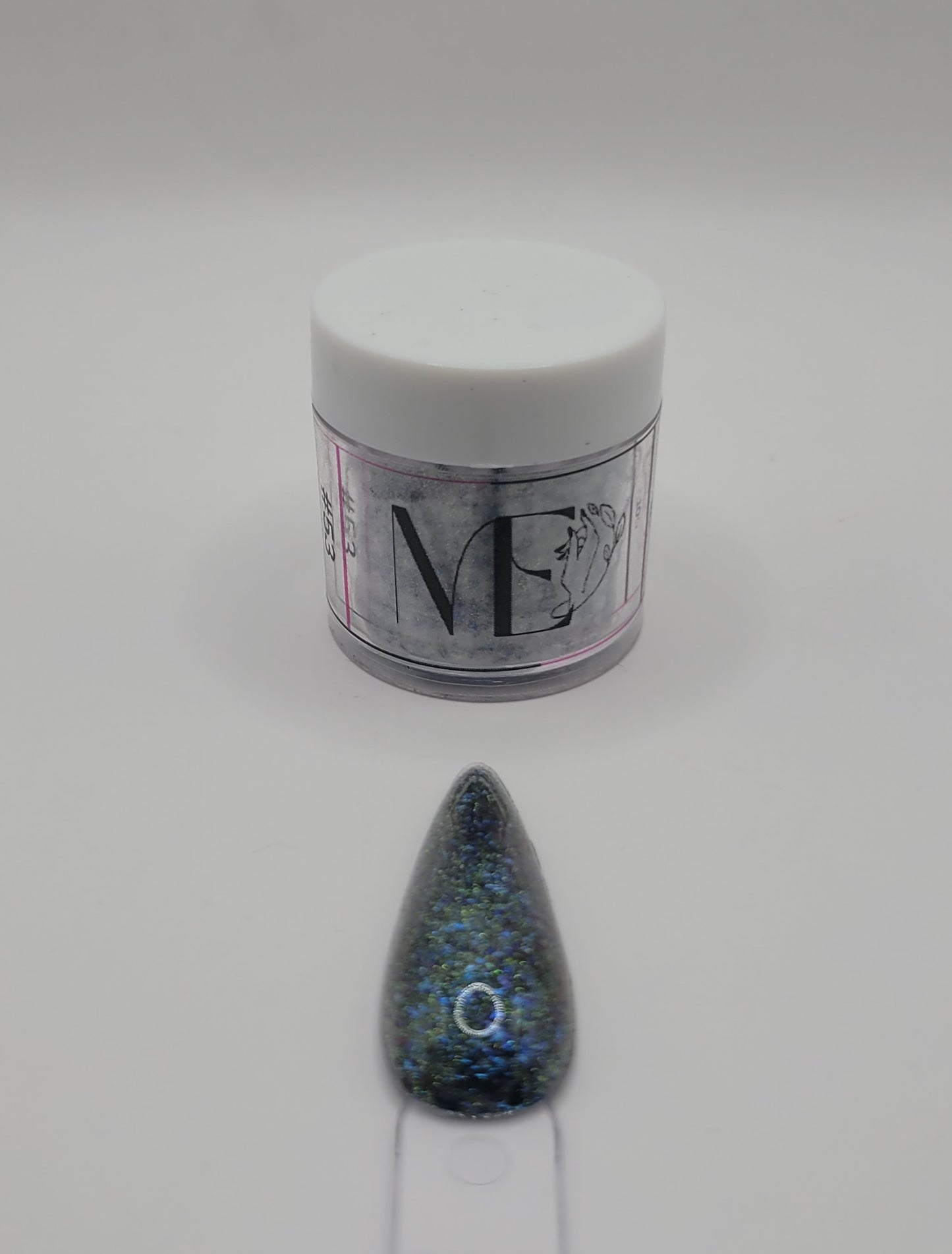 1 Jar of chameleon glitter Acrylic powder with 'ME' branding and a nail art swatchstick samples on a white background