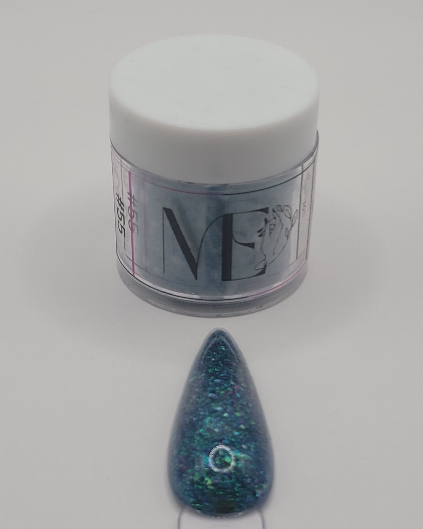 1 Jar of chameleon glitter Acrylic powder with 'ME' branding and a nail art swatchstick samples on a white background