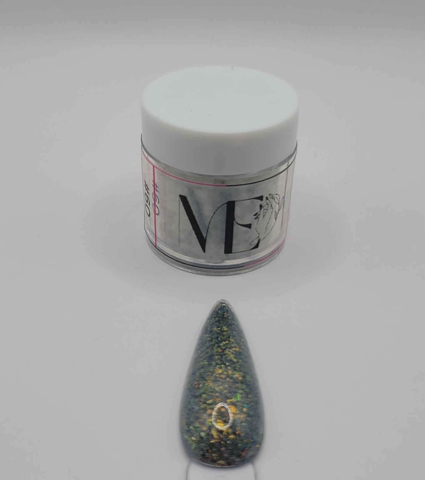 1 Jar of chameleon glitter Acrylic powder with 'ME' branding and a nail art swatchstick samples on a white background