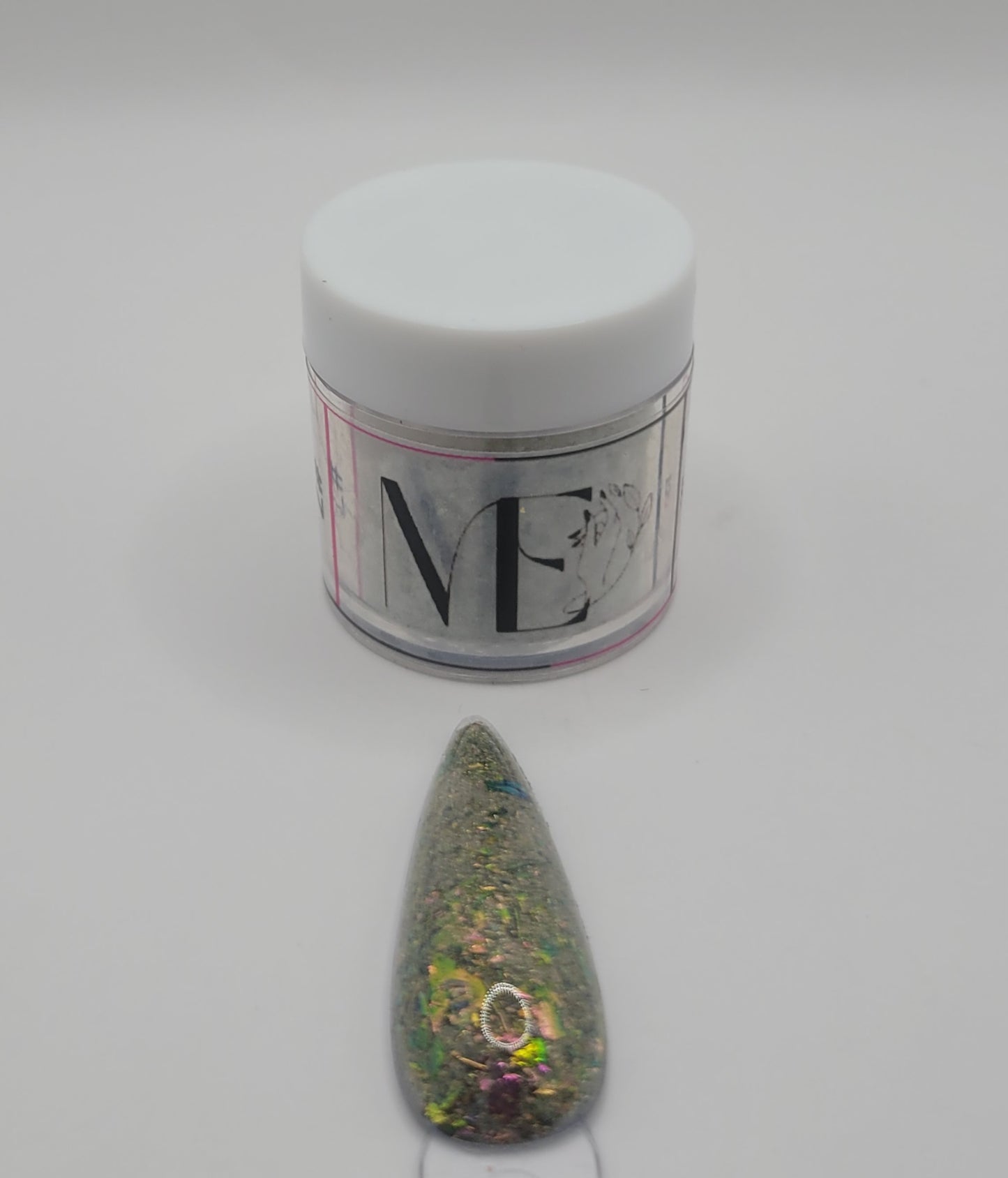 1 Jar of chameleon glitter Acrylic powder with 'ME' branding and a nail art swatchstick samples on a white background