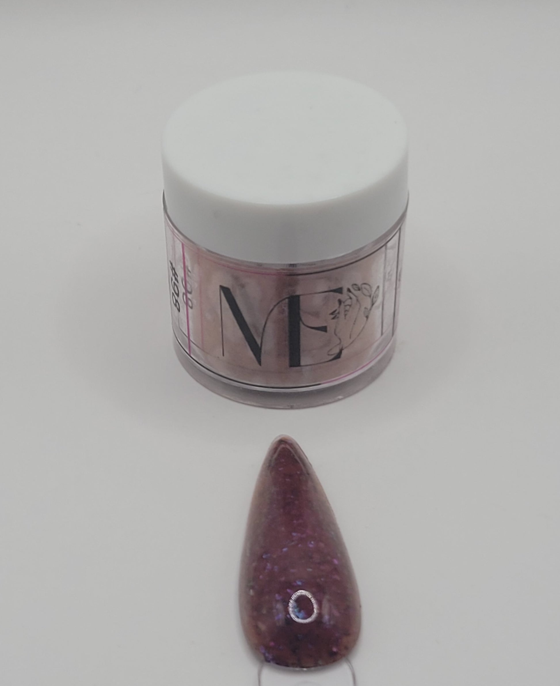1 Jar of chameleon glitter Acrylic powder with 'ME' branding and a nail art swatchstick samples on a white background