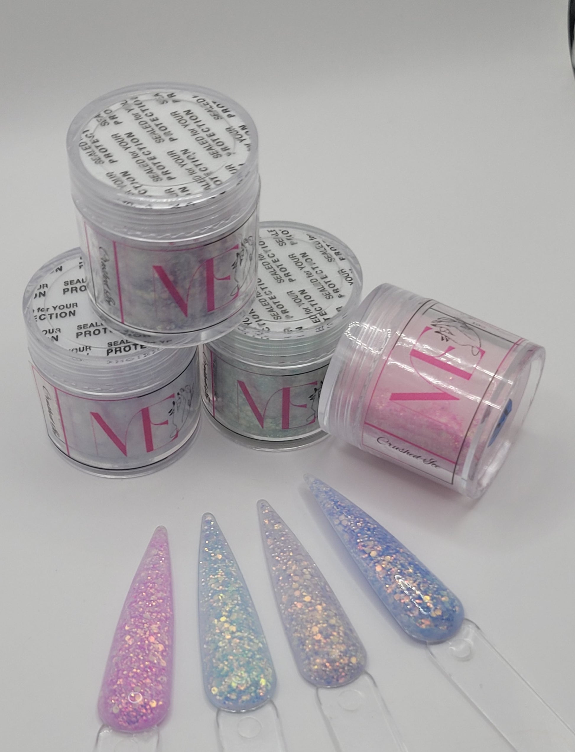 4 Jars of ice glitter acrylic powder with decorative 4 nail swatchsticks  on a white background