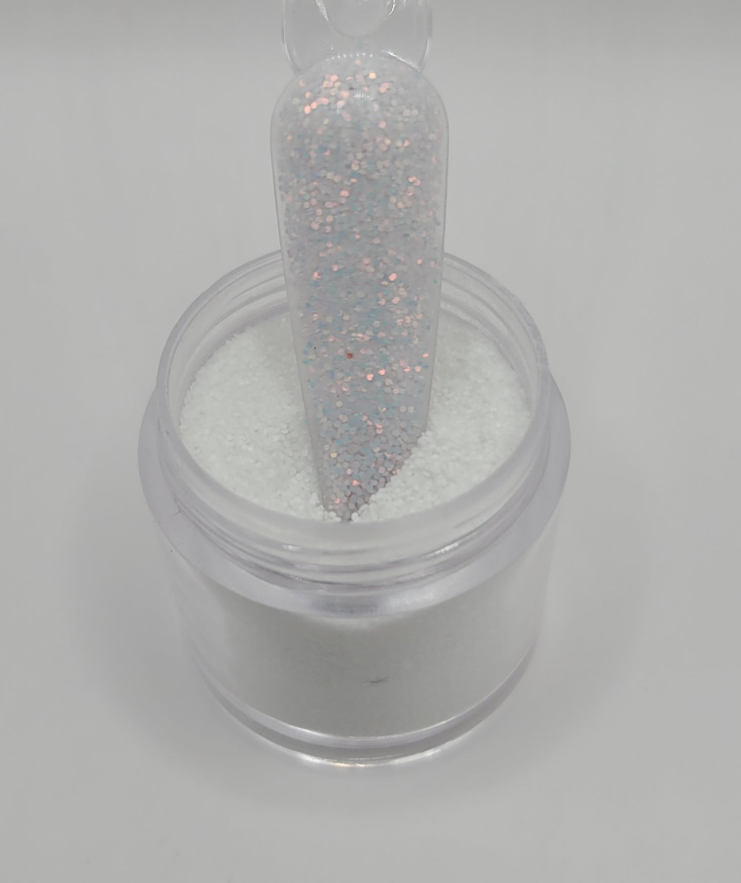 1 Jars of snow glitter acrylic powder with decorative 1 nail swatchsticks  on a white background