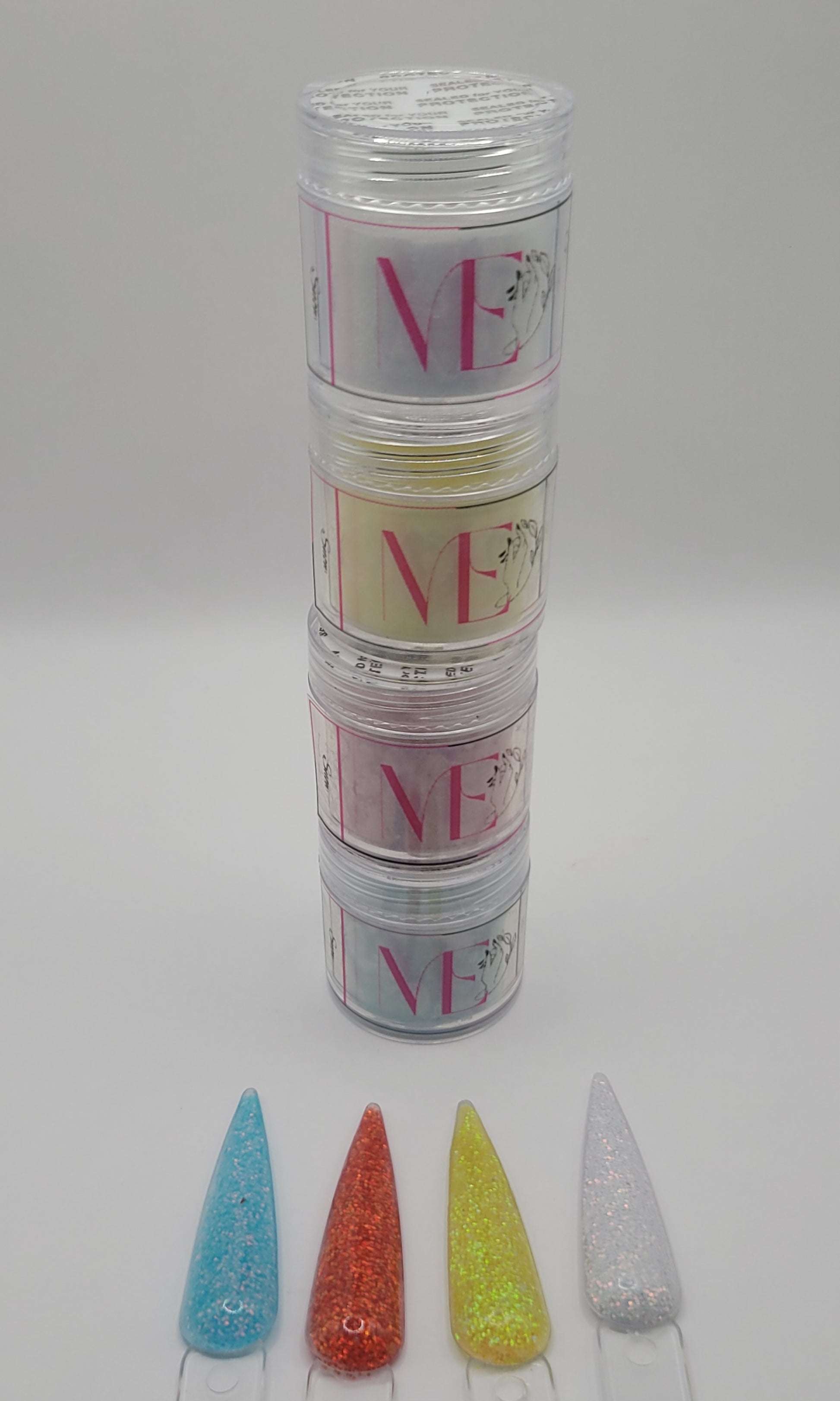 4 stacked Jars of snow glitter acrylic powder with decorative 4 nail swatchsticks  on a white background
